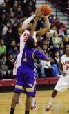 T.F. North's Gabriel Stinson shoots around