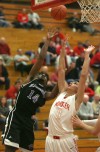 Hammond's Michael Kirkendall and Munster's Craig Dedelow vie for a rebound