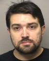 Police Man held at gunpoint after breaking into wrong apartment