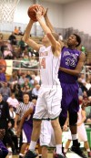 Valparaiso's John Mosser shoots against Merrillville's Zoran Talley on Friday.
