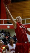 Munster's Nate Babash steals a rebound from E.C. Central on Saturday.