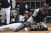 White Sox right fielder Brent Lillibridge scores a run behind