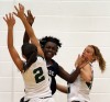 Illiana Christian's Mallory Fulton and Katie Ketelaar tie up Washington's Kourtney Williams