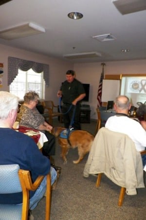 Barnabus the Comfort Dog attends Portage Exchange Club meeting