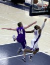 Merrillvile's Jalen Wilbert drives for a layup and draws a foul from from Hobart's Patrick Wynn on Thursday night.