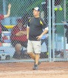 Griffith head coach Don Bence talks to one of his players at the plate Tuesday night during the Class 3A regional championship against Hanover Central.