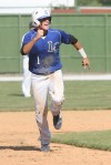 Lake Central's Alex Olund heads to third base