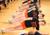 Beecher softball players stretch before practice