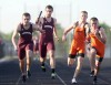 Runners from Chesterton and LaPorte compete in the 400-meter relay
