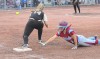 Hanover Central's Melissa Balkema dives back into first before Griffith's Jamie Rex can make the catch Tuesday night during the Class 3A Regional championship in Cedar Lake.
