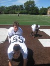 Mt. Carmel center John Mucha snaps to quarterback Chris Sujka in August.