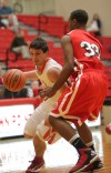 Crown Point's Alex Nickla drives against Morton's Travon Atkins