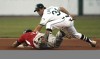 060711BBMRAILCATS, RailCats' Chris Carrara tags out Sioux City's Javier Brito