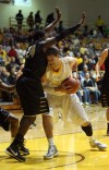 Purdue Calumet's Roddy Richardson tries to stop a shot attempt by Valparaiso University's Bobby Capobianco