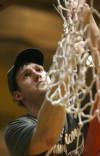 Kevin Van Vijk cuts down the net after Valparaiso defeated Wright State in the Horizon League men's basketball tournament championship.