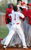 Crown Point players mob pitcher Zach Plesac