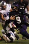 Merrillville quarterback Jake Raspopovich runs for a touchdown