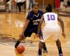 Michigan City's Jameka Collins receives defensive pressure from Merrillville's Dariyan Morris