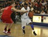 Lake Central's Tye Wilburn drives past Munster's Pat McCarthy