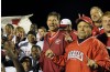 T.F. South football team celebrates a win over Tinley Park and Tom Padjen's 200th win