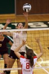 Chesterton's Shelby Ruffner taps the ball back over the net 
