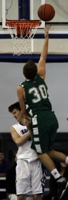 Lake Central's Chris Tuskan fouls Valparaiso's Zach Meyer