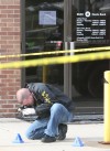 Two Gary men charged, cop shot in Hammond bank robbery