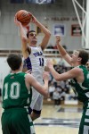 Merrillville's Jacob Raspopovich shoots over Valparaiso's defense Saturday night.