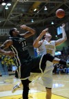 Valparaiso University's Kevin Van Wijk fights for a rebound with Chicago State's Jeremy Robinson