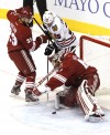 Phoenix's Mike Smith, Adrian Aucoin and Blackhawks Viktor Stalberg