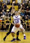 Boone Groves' Dean Hill looks to shoot against Kouts' Nick Taylor 