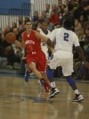 Guarded by Lake Central's Tye Wilburn, Munster's Craig Dedelow prepares to pass the ball. 