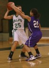 Valparaiso's Andi Sarkisian is pressured by Merrillville's Myranda Harris on Thursday.