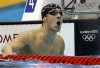 Phelps goes out in style, rallying in 100 fly