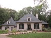 Warmth and worldly flair define a vast riverside estate