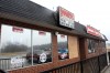 Cops: Man pushed another through glass window