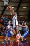 West Side players Jerrica Neal and Tinon Hunter go up for a rebound 