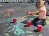 Kids paint the Crete Library parking lot