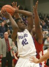 Merrillville's Jelani Pruitt is defended by Portage's Tyler McCann on Friday.