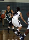 Bishop Noll's Julia Kusiak defends Whiting's Citlali Lopez on Saturday night.