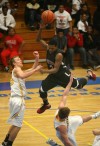 21st Century's Mykel Mayes is fouled by Pioneer's Stephen Whitlock