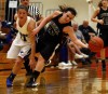Lake Central's Tara Zlotkowski and Lowell's Kalyne Godbolt, left, go for a loose ball S