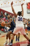 Michigan City senior Aubria Smith attempts to shoot past Merrillville senior forward Amber Sturdivant