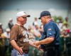 Mount Carmel coach Brian Hurry questions a sixth-inning call