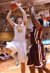 Valparaiso University's Ryan Broekhoff scores over the Robert Morris