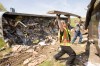 Overturned trash hauler snarls U.S. 30 traffic