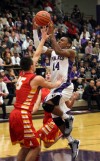 Merrillville's Jalen Wilbert shoots over Andrean's Nick Davidson