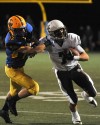 MTC LT 8AMount Carmel wide receiver Jason Gasser fights for extra yards after a first-quarter reception-4.jpg