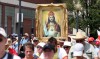 Pilgrims trek through rain for religious journey