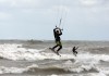 Surfers take on choppy Lake Michigan waters